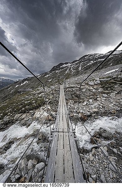 Suspension bridge over torrent at the Olpererhütte  Zillertal Alps  Glacier Schlegeiskees  Zillertal  Tyrol  Austria  Europe