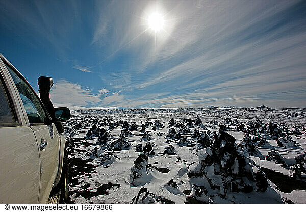SUV driving through snowy landscape in the Icelandic highlands