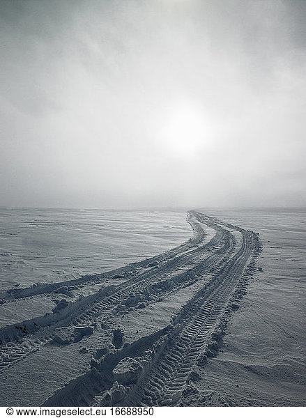 SUV tyre tracks in the snow on Icelandic glacier