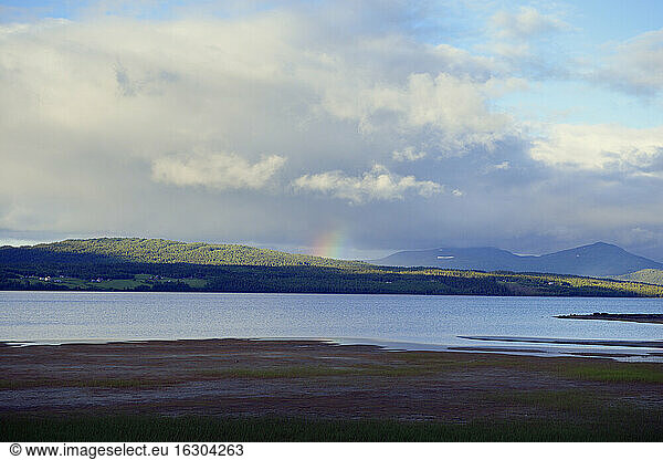 Sweden  Gaeddede  Lake Stor-Blasjoen in the evening with rainbow