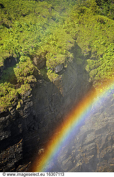Sweden  Gaeddede  Rainbow at waterfall Haellingsafallet