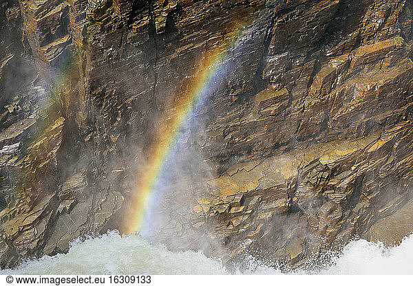 Sweden  Gaeddede  Rainbow at waterfall Haellingsafallet