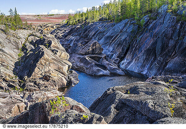 Sweden  Norrbotten County  Porjus  Rocky valley and small lake in Muddus National Park