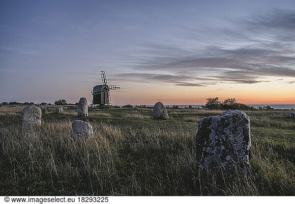 Sweden  Oland  Gettlinge  Old burial ground with windmill in background