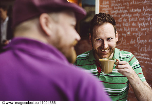 Sweden  Stockholm  Gamla Stan  Two men having coffee in cafe