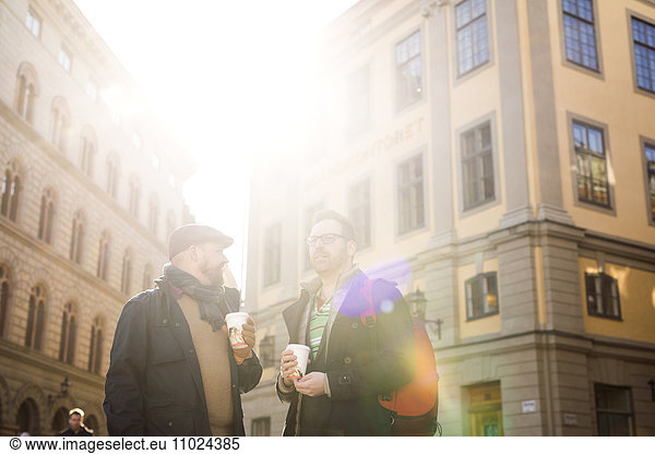 Sweden  Stockholm  Gamla Stan  Two men having coffee outdoors