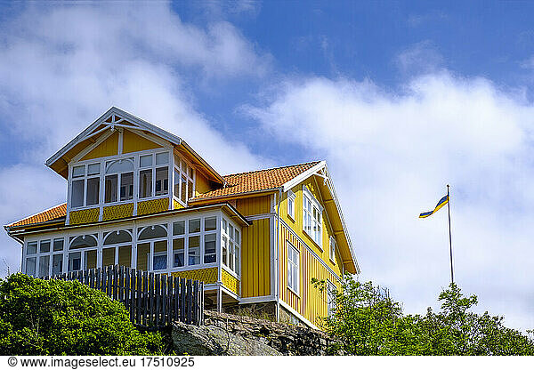 Sweden  Vastra Gotaland County  Fiskebackskil  Yellow painted cottage in summer