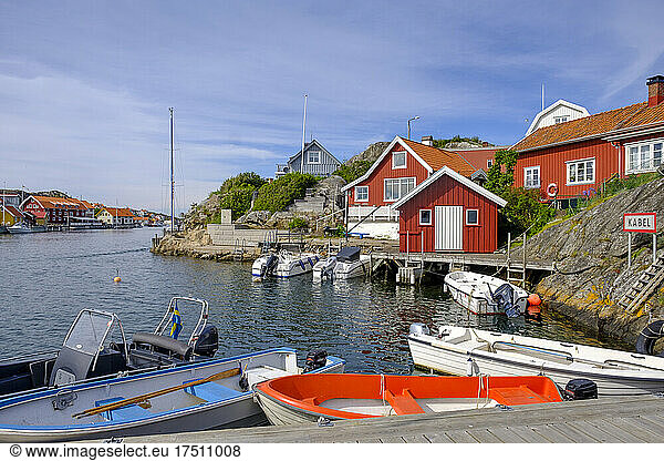 Sweden  Vastra Gotaland County  Kyrkesund  Motorboats moored in fishing village