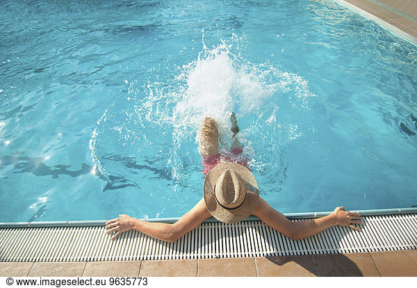 Swimming pool fun holiday water splashing teenager
