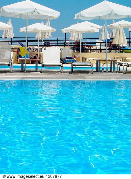 Swimming pool  sunshades  sun-loungers  Aegean Palace Hotel  Crete  Greece