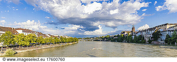 Switzerland  Basel-Stadt  Basel  Clouds over river Rhine flowing through city