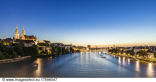 Switzerland  Basel-Stadt  Basel  Long exposure of river Rhine at dusk with Basel Minster cathedral in background
