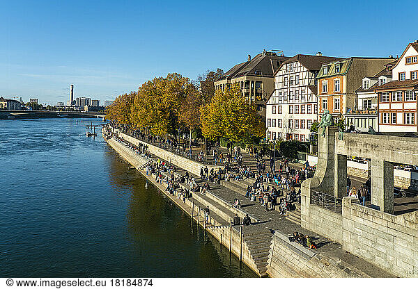 Switzerland  Basel-Stadt  Basel  People relaxing along riverside promenade in autumn
