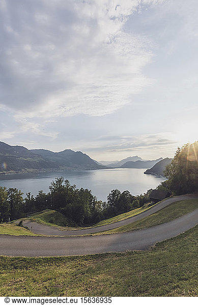 Switzerland  Gersau  Schwyz  Winding road at sunset with Lake Lucerne in background