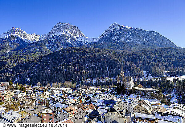Switzerland  Graubunden Canton  Scuol  View of winter town in Engadine valley with mountains in background