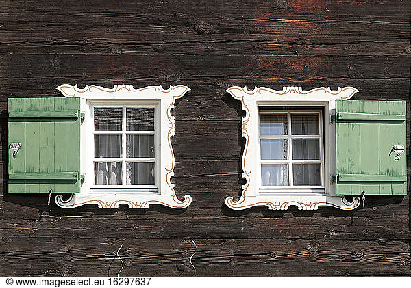 Switzerland  Grindelwald  facade of traditional frame house with two windows and shutters