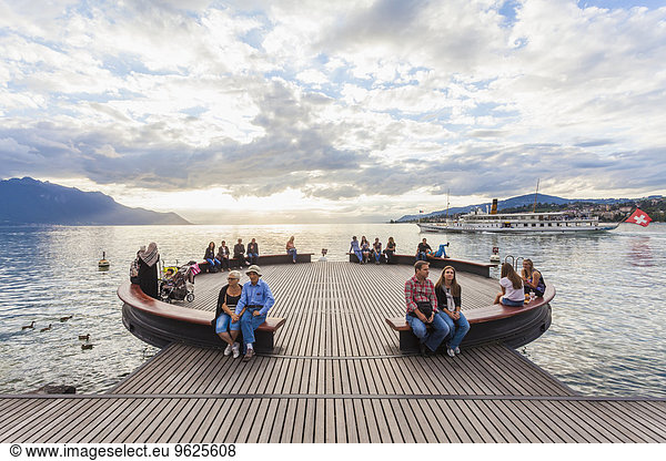 Switzerland  Montreux  Lake Geneva  people on jetty at lakeshore