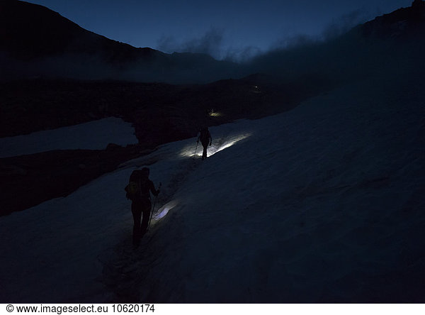 Switzerland  Wallis  Saas-Grund  Pennine Alps  Weissmies  female mountaineer at night