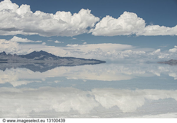 Symmetry view of Bonneville Salt Flats against cloudy sky