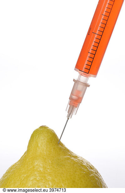 Syringe in lemon  symbolic picture  genetically modified foods