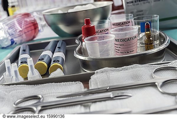 Syringes of insulin medication next to medicine vials prepared in hospital  conceptual image .