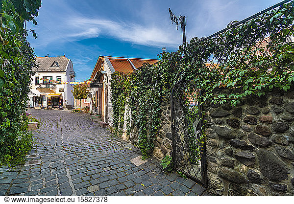 Szentendre city historic passage with shops and blue skies