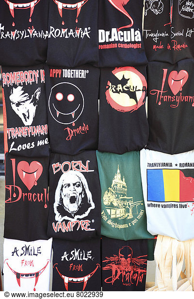 T-shirts with Dracula and vampire designs in a souvenir shop