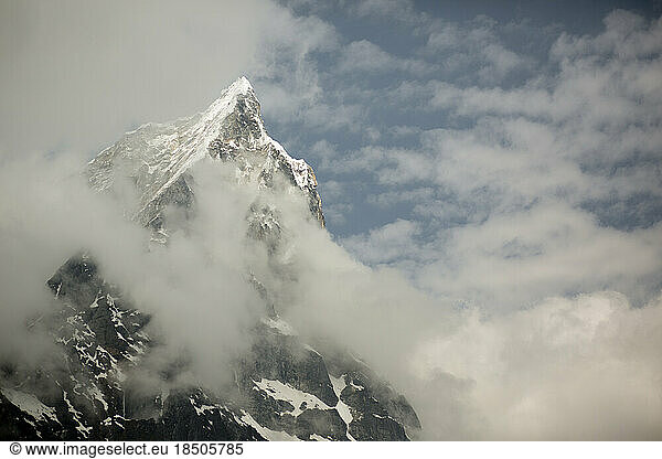 Tabouche peak in the Everest Region is wrapped in clouds in Nepal.