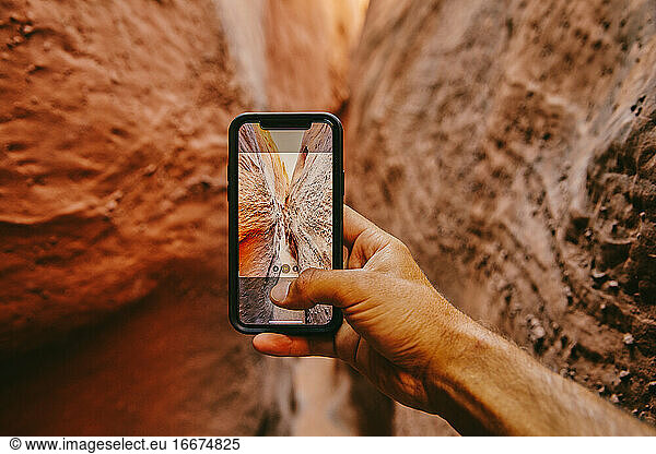 Taking picture with phone of narrow slot canyons in Escalante  Utah