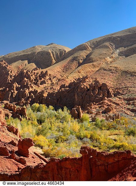 Tamnalt Kasbahs with red rock and limestone fingers in Dades Gorge Morocco