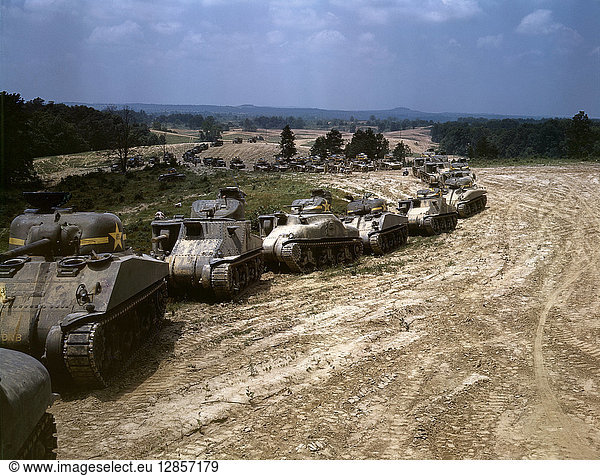 TANK MANEUVERS, 1942. Parade of M-4 'Sherman' and M-3 'Grant' tanks during training maneuvers at Fort Knox, Kentucky. Photograph by Alfred T. Palmer, June 1942.