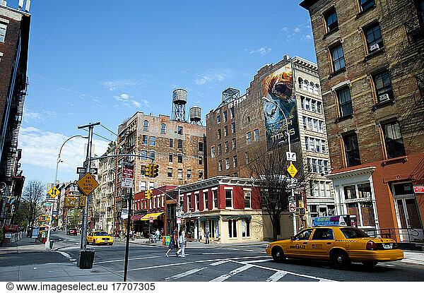 Taxi Driving Through A Street Between Tribeca And Soho  Manhattan  New York  Usa