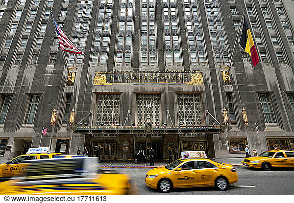 Taxis Passing By The Waldorf Astoria Hotel In Midtown Manhattan  New York  Usa