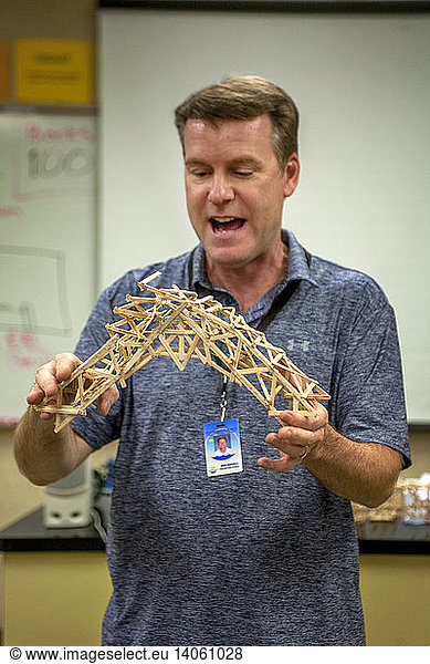 Teacher Showing Structural Bridge Model