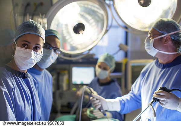 Team of surgeons during operation in operating theater