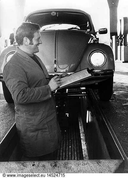 technics  workshops  garages  mechanic checking a VW Beetle in a repair shop of the German Technical Inspection Association  West Germany  circa 1970