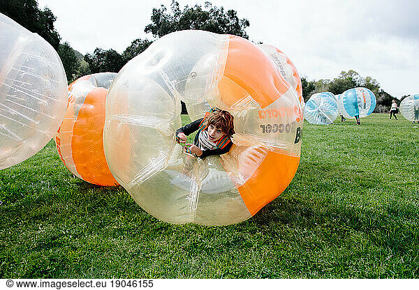 Teen girl knocked down during bubble soccer contemplates how to get up