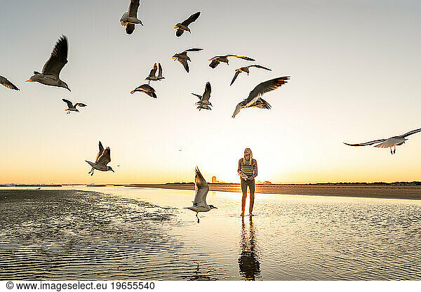 Teen girl on Texas beach at sunset