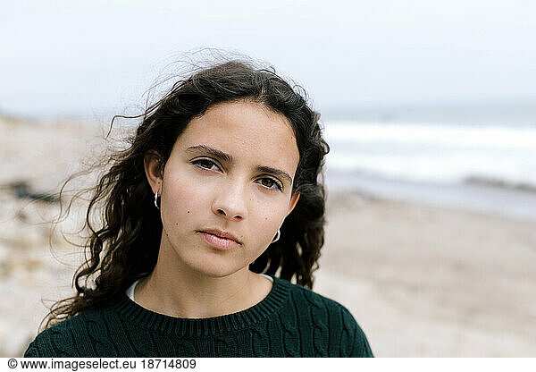 Teen Girl With A Serious Expression At The Beach