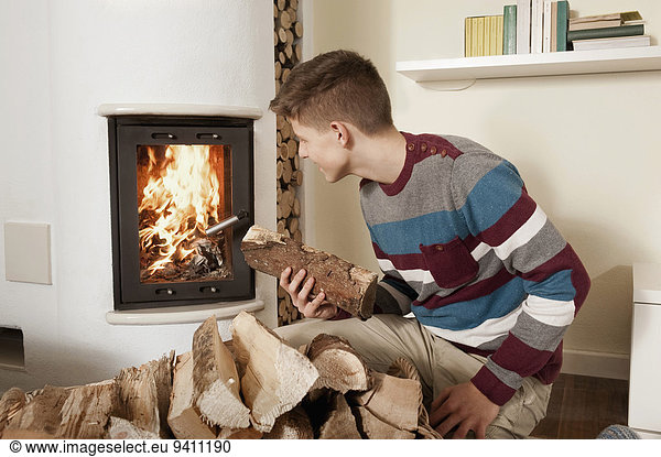 Teenage boy in front of fireside