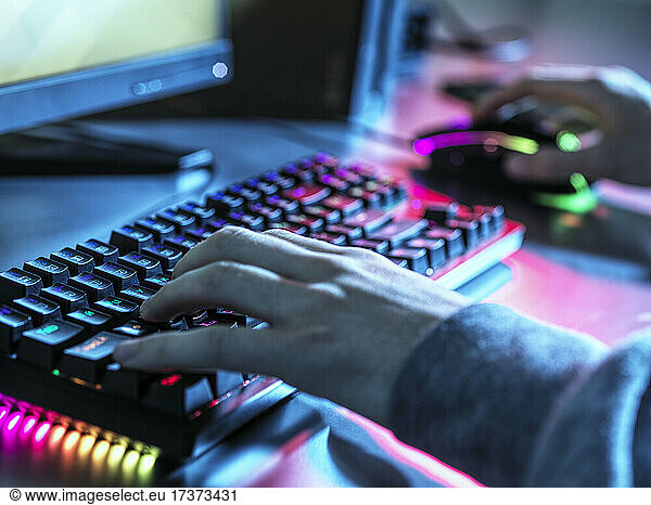 Teenage boy using keyboard and mouse