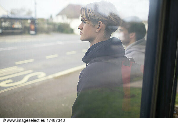 Teenage boys waiting at bus stop