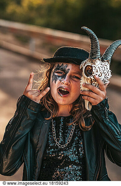Teenage girl in hard rock costumes celebrate Halloween party