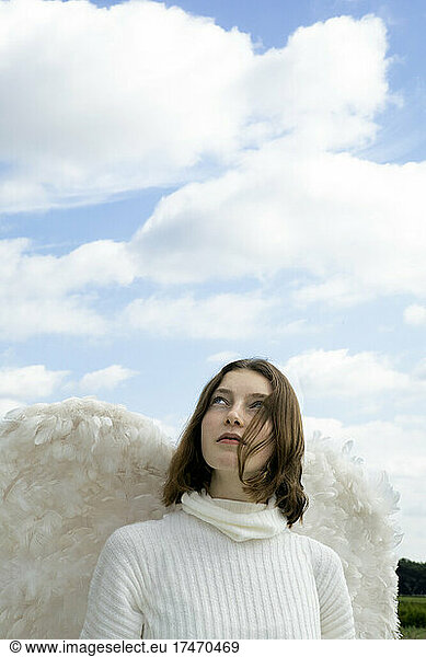 Teenage girl in white angel costume