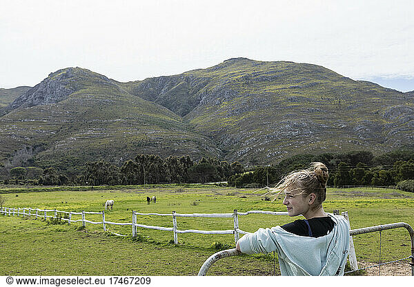 teenage girl looking at horses  Stanford  South Africa