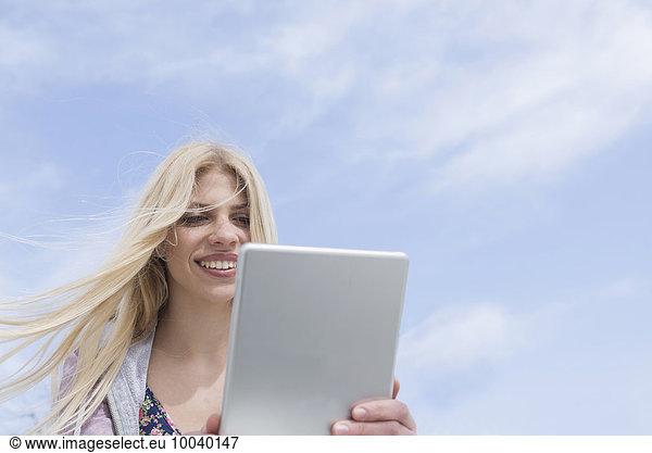 Teenage girl using a digital tablet  Munich  Bavaria  Germany