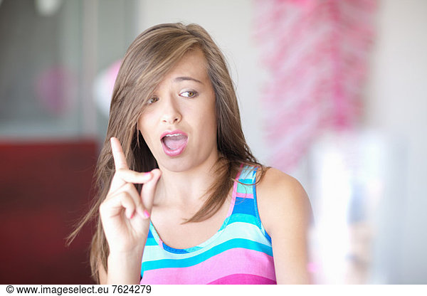 Teenage girl wagging a finger