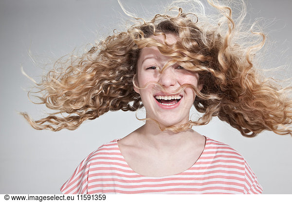 Teenage girl with windswept hair