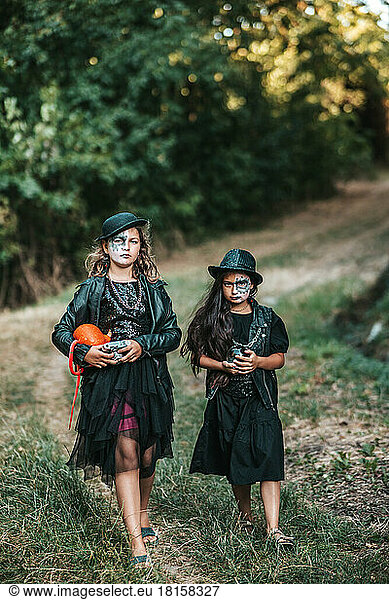 Teenage girls in hard rock costumes celebrate Halloween party