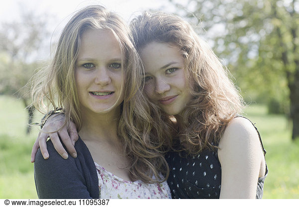 Teenage girls posing and smiling  Freiburg im Breisgau  Baden-Württemberg  Germany